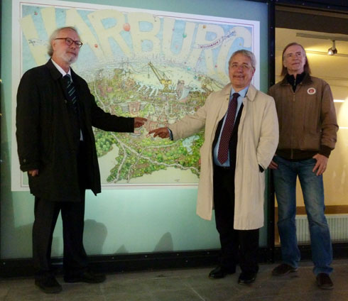 Jürgen Marek (links), Thomas Völsch und Ulf Harten vor dem Wimmelposter im Gloriatunnel (Foto Gisela Baudy)